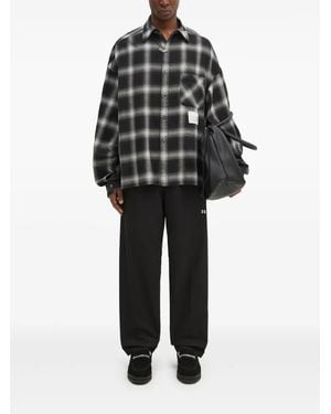 Undercover Pantalones con bolsillo plisado - Negro