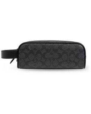 coach travel toiletry bag Purse: Brown Kit Signature coated canvas and smooth calf leather Inside multifunction pocket Zip closure fabric lining Handle with 2 1/4 drop Outside open pocket 8 3/4 (L) x 5 (H) x 3 1/4 (W) Style No. Vtg Rare/limited edition/hard to find
