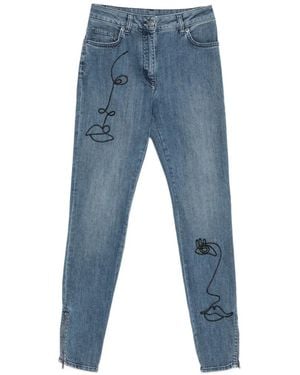 Moschino Face-Embroidery Zip-Cuff Jeans - Blue
