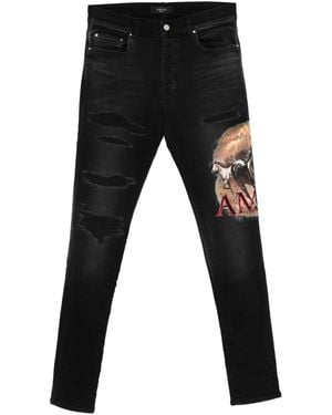 Amiri Ripped Graphic Jeans - Black