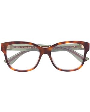 Gucci Web arm tortoiseshell glasses - Marrón