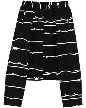 COMME DES GARÇON BLACK Pantaloni Con Stampa - Nero