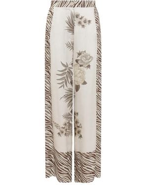 Anna Molinari Pantalones con estampado floral y estampado de cebra - Gris