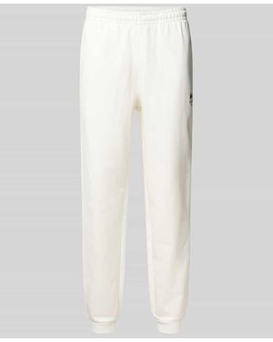 Lacoste Tapered Sweatpants aus reiner Baumwolle - Weiß