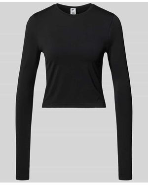 Fabletics Slim Fit Longsleeve mit Rundhalsausschnitt Modell 'Feather' - Schwarz