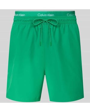 Calvin Klein Regular Fit Badeshorts mit integriertem Slip - Grün