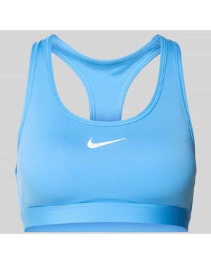 Nike Slim Fit Sport-BH mit Logo-Print Modell 'Swoosh' - Blau