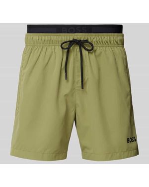 BOSS Relaxed Fit Badeshorts mit Label-Print Modell 'AMUR' - Grün