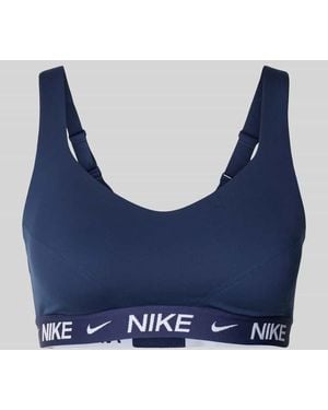 Nike Slim Fit sport-BH mit Logo-Detail Modell 'Indy' - Blau