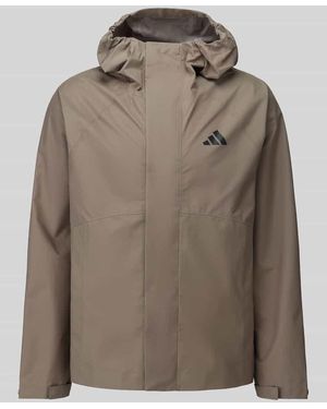 adidas Funktionsjacke mit reflektierendem Logo-Detail - Braun