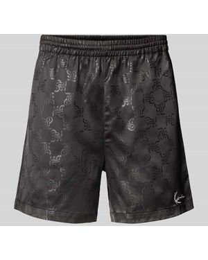 Karlkani Relaxed Fit Shorts mit Allover-Logo-Print Modell 'Signature' - Schwarz