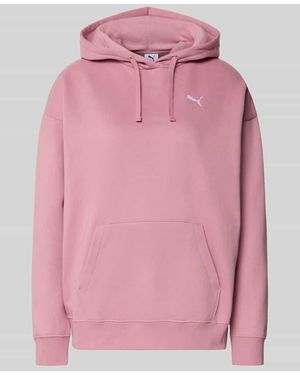 PUMA Relaxed Fit Hoodie mit Label-Stitching und Känguru-Tasche - Pink