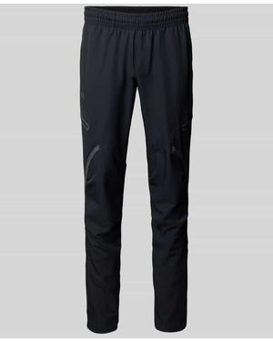Under Armour Relaxed Fit Trainingshose mit Cargotaschen Modell 'Unstoppable' - Blau