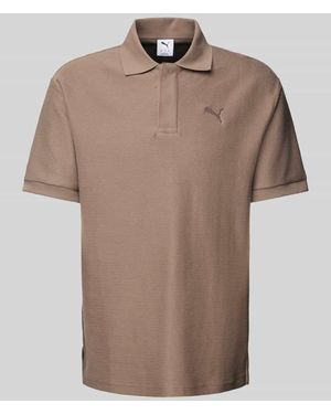 PUMA Relaxed Fit Poloshirt mit Label-Stitching - Natur