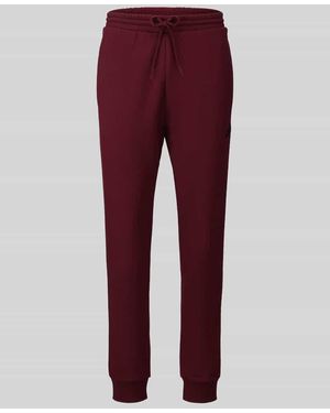 adidas Regular Fit Sweathose aus Baumwoll-Mix Modell 'FEELCOZY' - Rot