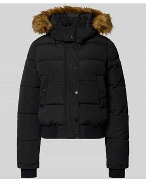 Review Steppjacke mit Kapuze, Kunstfellbesatz und Rippbündchen - Schwarz