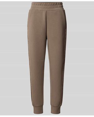 Guess Slim Fit Sweatpants mit Viskose-Anteil Modell 'Victoire' - Natur