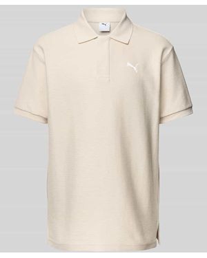 PUMA Relaxed Fit Poloshirt mit Label-Stitching - Natur