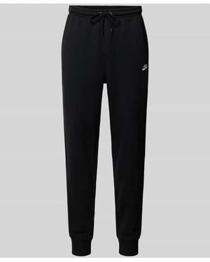 Nike Sweatpants mit Label-Stitching und Gesäßtasche - Schwarz
