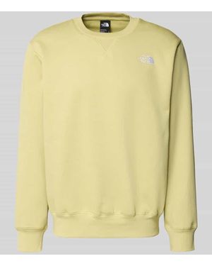 The North Face Relaxed Fit Sweatshirt mit Label-Stitching Modell 'ESSENTIAL' - Gelb