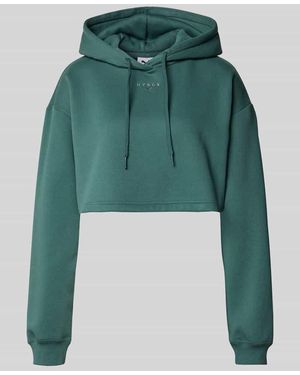 PUMA Regular Fit Sweatshirt aus Baumwoll-Mix X HYROX - Grün