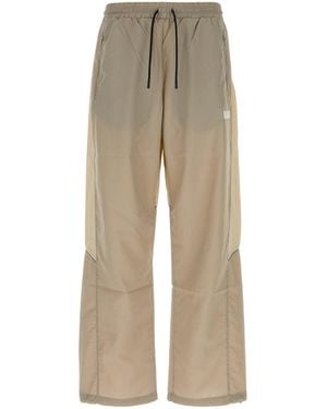Reebok Two-tone Stretch Nylon joggers - Natural
