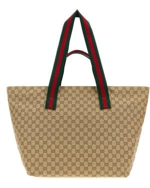 Gucci Borsa shopping media in tessuto GG - Marrone