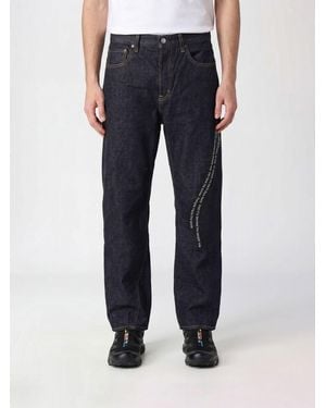 Undercover Straight Fit Stretch Denim Jeans With Slogan Print And Mid-Rise Waist - Blue