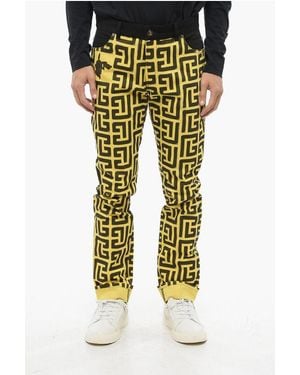 Balmain Pokemon Two-Tone Jeans With Cuffed Hem And All-Over Monogram - Yellow