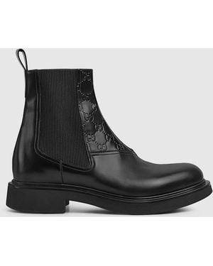 Gucci Ggエンボス ディテール メンズ アンクルブーツ, ブラック, レザー