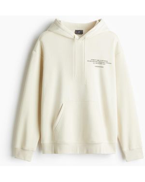 H&M Bedruckter Hoodie in Oversized Fit - Weiß