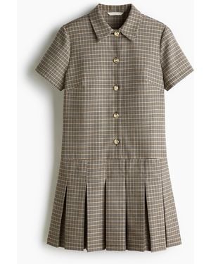 H&M Kleid mit Plisseejupe - Schwarz