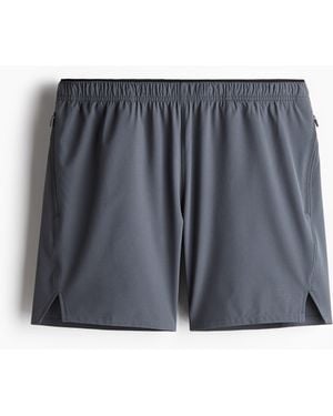 H&M Halblange Laufshorts mit DryMoveTM - Grau
