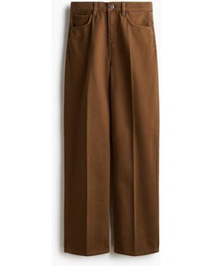 H&M Jeans mit weitem Bein und Bügelfalten - Braun