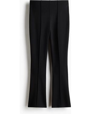 H&M Cropped crease-front leggings - Schwarz