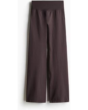 H&M Ausgestellte Seamless Sportleggings mit DryMove - Braun