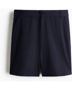 H&M Chino mit Vierwegestretch in Loose Fit - Blau