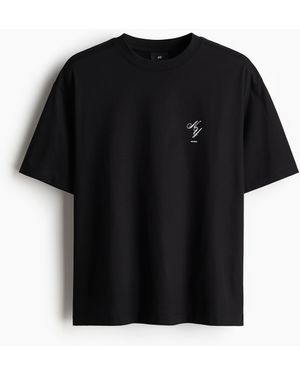 H&M Bedrucktes T-Shirt in Loose Fit - Schwarz