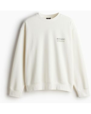 H&M Bedrucktes Sweatshirt in Loose Fit - Weiß