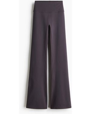 H&M Ausgestellte Yogaleggings mit SoftMoveTM - Lila