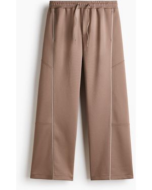 H&M Track Pants aus Scuba in Loose Fit - Braun