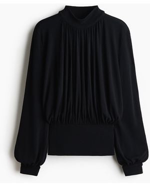H&M Geripptes Shirt mit Ballonärmeln - Schwarz