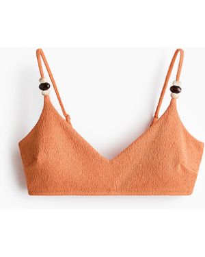 H&M Wattiertes Bikinitop - Orange