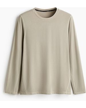H&M Langarm-Sportshirt mit DryMove in Regular Fit - Natur