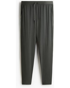 H&M Sporthose mit DryMoveTM in Slim Fit - Grau