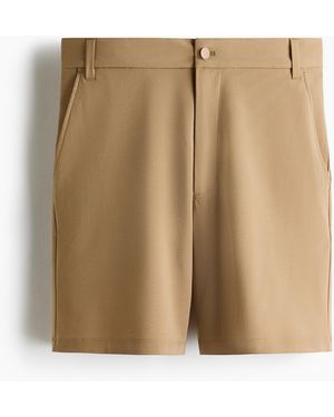 H&M Chino mit Vierwegestretch in Loose Fit - Natur