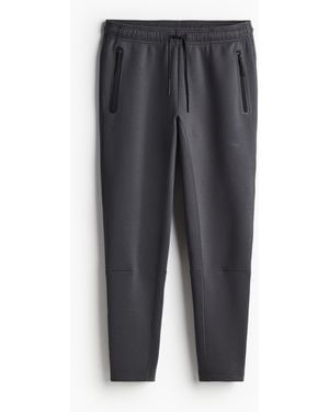 H&M Sport-Joggpants mit DryMove in Slim Fit - Grau