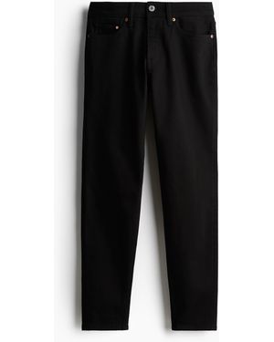 H&M Regular Tapered Jeans - Schwarz