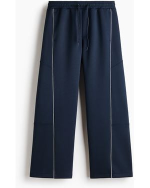 H&M Track Pants aus Scuba in Loose Fit - Blau