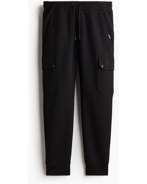 H&M Joggpants aus Scuba in Slim Fit - Schwarz